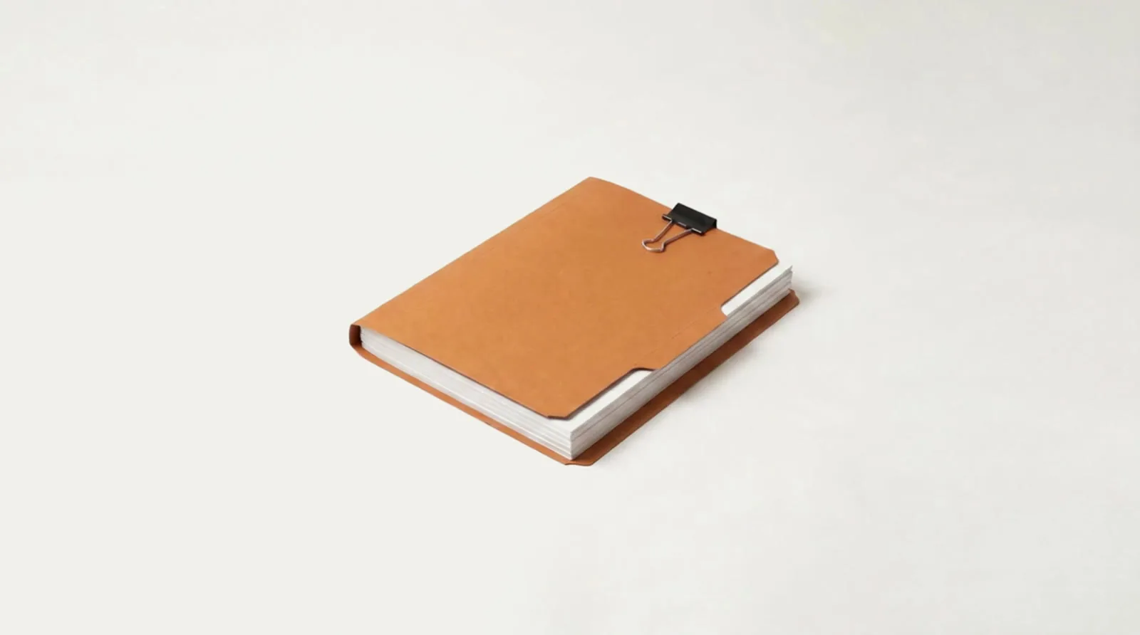 The same paperwork squared into one neat stack in an orange folder